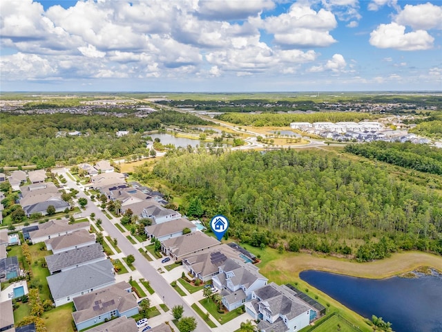 16712 Courtyard Loop, Land O Lakes, FL 34638 - aerial view of residential area featuring a nearby body of water and a forest