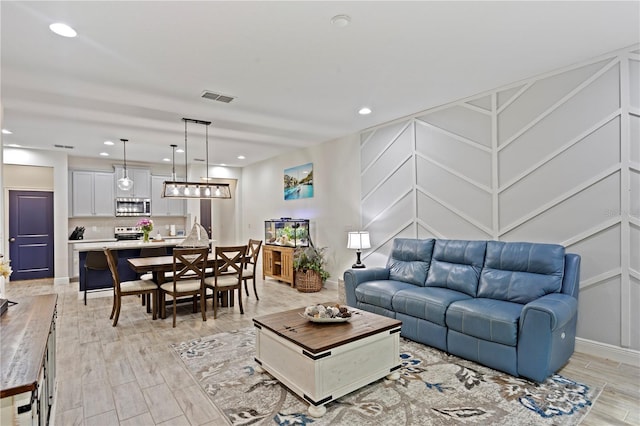 14110 Damselfly Dr, Tampa, FL 33625 - living room featuring light wood-style flooring and recessed lighting