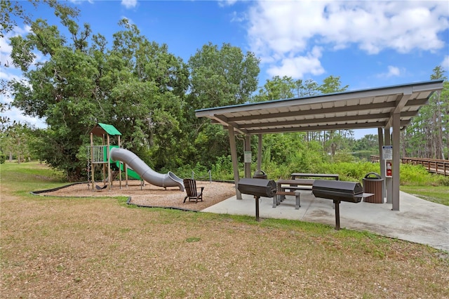 14110 Damselfly Dr, Tampa, FL 33625 - community play area featuring a yard and view of wooded area