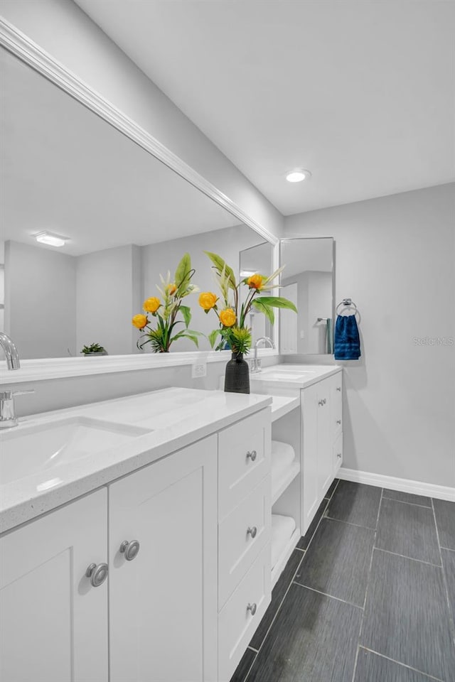 full bath with vanity, baseboards, recessed lighting, and tile patterned flooring
