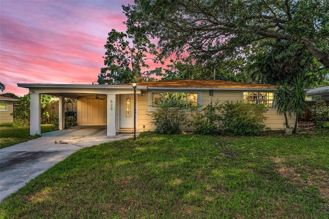 629 Lexington St, Dunedin, FL 34698 - ranch-style home with driveway and an attached carport