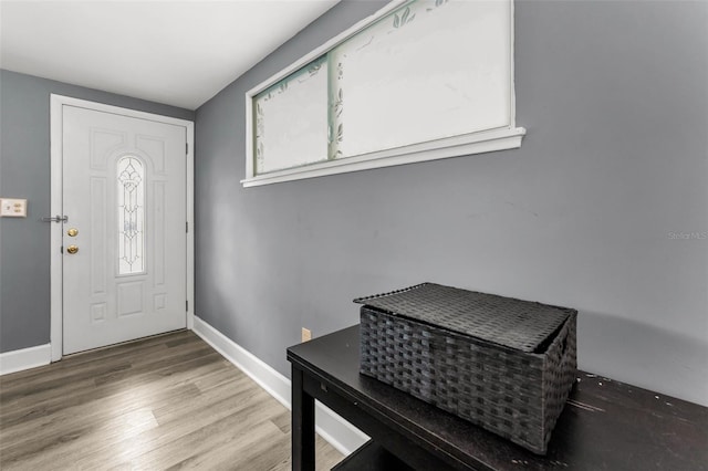 629 Lexington St, Dunedin, FL 34698 - entrance foyer featuring wood finished floors and baseboards