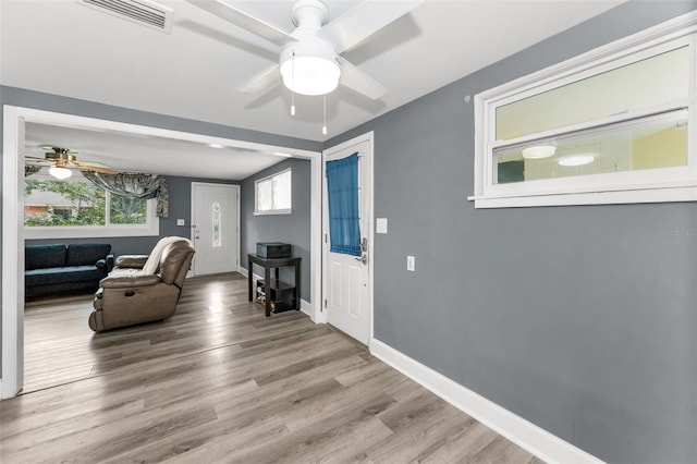 629 Lexington St, Dunedin, FL 34698 - living area with ceiling fan and wood finished floors