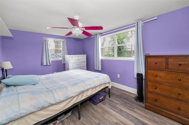629 Lexington St, Dunedin, FL 34698 - bedroom featuring wood finished floors and a ceiling fan