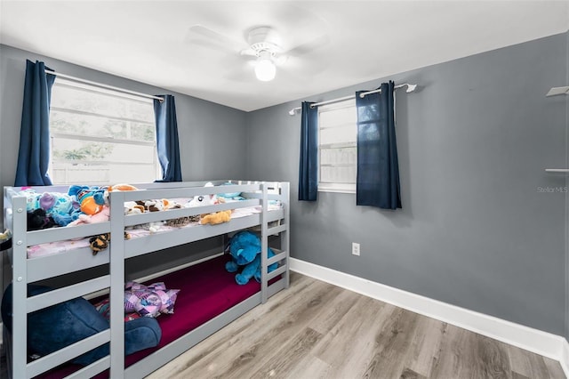 629 Lexington St, Dunedin, FL 34698 - bedroom featuring wood finished floors and a ceiling fan