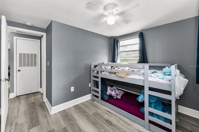 629 Lexington St, Dunedin, FL 34698 - bedroom featuring wood finished floors and a ceiling fan