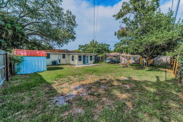 629 Lexington St, Dunedin, FL 34698 - fenced backyard with a storage shed