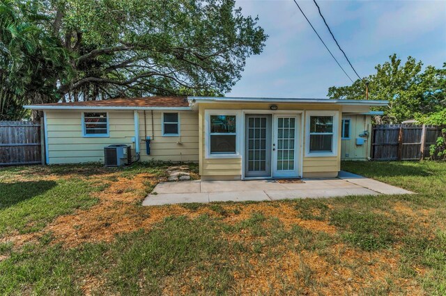 629 Lexington St, Dunedin, FL 34698 - rear view of property featuring a fenced backyard and a patio