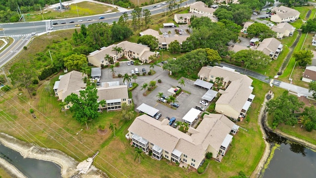 aerial overview of property's location featuring nearby suburban area and a large body of water