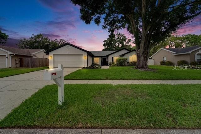 10412 Tara Dr, Riverview, FL 33578 - ranch-style house featuring an attached garage and concrete driveway