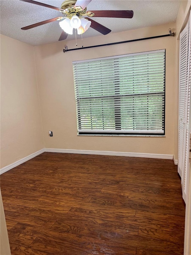 1020 85th Ave N Unit 223, Saint Petersburg, FL 33702 - spare room featuring a textured ceiling, a ceiling fan, wood finished floors, and baseboards