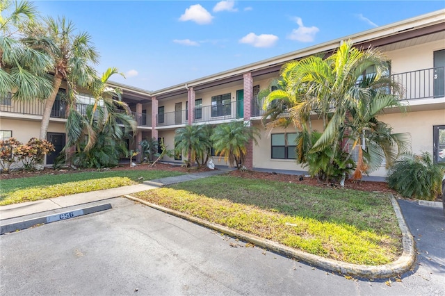 1020 85th Ave N Unit 223, Saint Petersburg, FL 33702 - view of property featuring uncovered parking