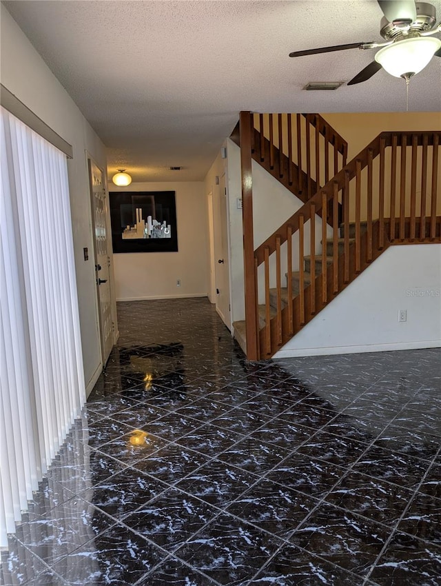 8114 Oak Trace Way Unit D, Tampa, FL 33634 - corridor with marble finish floors, a textured ceiling, and baseboards