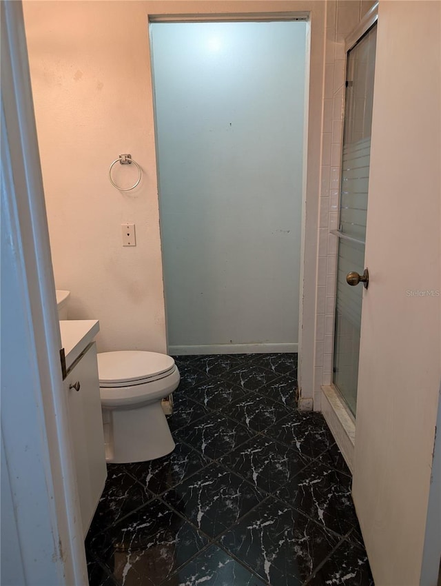 8114 Oak Trace Way Unit D, Tampa, FL 33634 - bathroom with vanity, marble finish flooring, toilet, and a stall shower