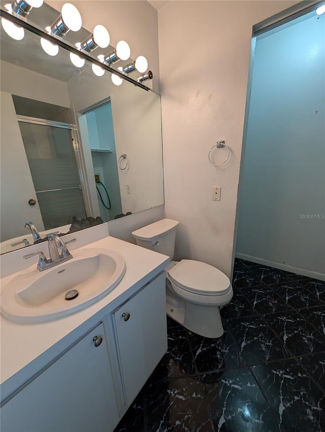 8114 Oak Trace Way Unit D, Tampa, FL 33634 - bathroom featuring marble finish floors, vanity, a stall shower, and toilet
