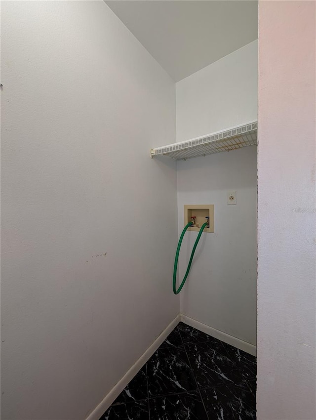 8114 Oak Trace Way Unit D, Tampa, FL 33634 - laundry area with dark marble finish floors, baseboards, hookup for a washing machine, and electric dryer hookup