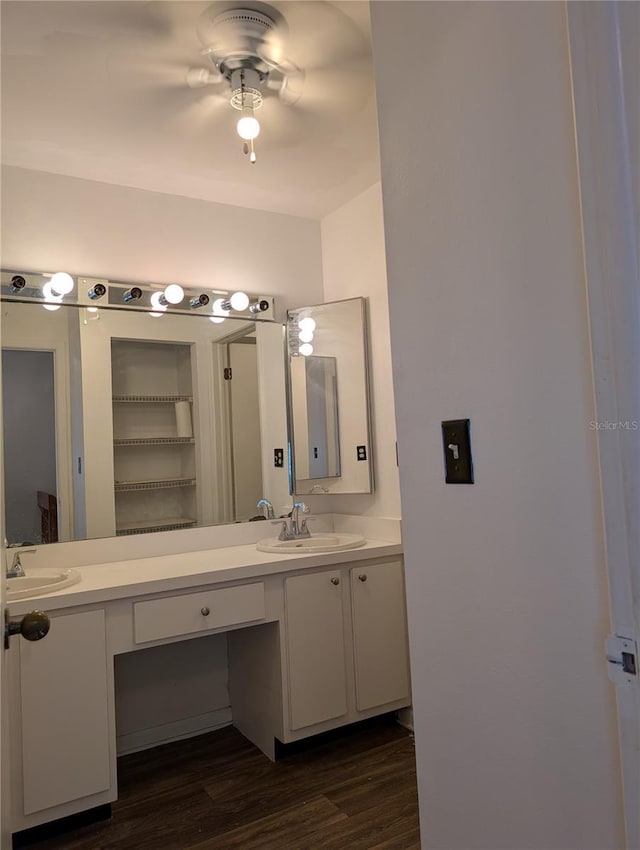 8114 Oak Trace Way Unit D, Tampa, FL 33634 - bathroom featuring wood finished floors and double vanity