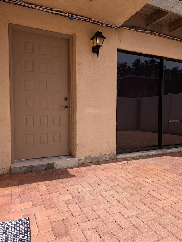 8114 Oak Trace Way Unit D, Tampa, FL 33634 - entrance to property featuring stucco siding