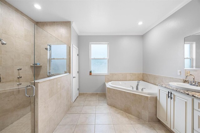 bathroom featuring a bath, a stall shower, tile patterned flooring, vanity, and ornamental molding