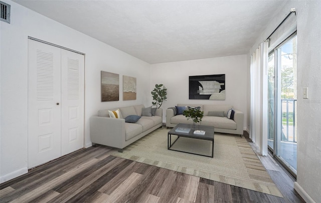 1799 N Highland Ave Unit 106, Clearwater, FL 33755 - living area with wood finished floors and baseboards