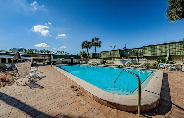 1799 N Highland Ave Unit 106, Clearwater, FL 33755 - community pool with a patio and fence