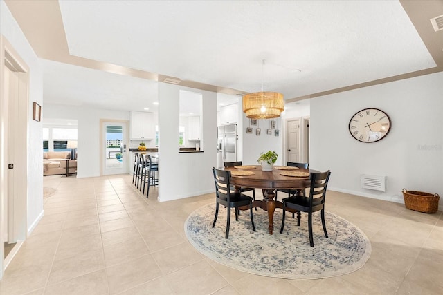 8848 Sunlit Cove Dr NE, Saint Petersburg, FL 33702 - dining area with light tile patterned floors and baseboards