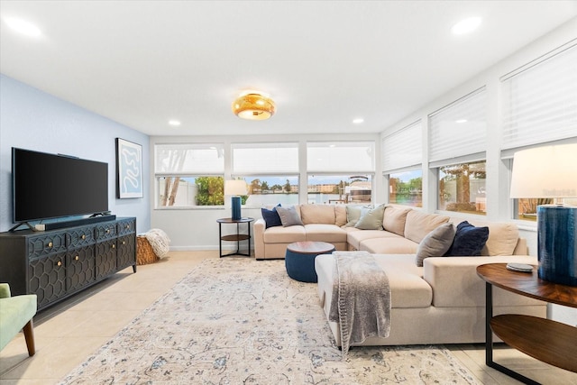 8848 Sunlit Cove Dr NE, Saint Petersburg, FL 33702 - living room with tile patterned floors, recessed lighting, and baseboards