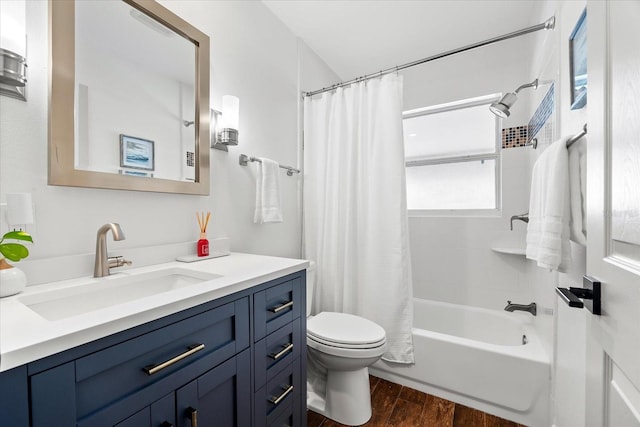 8848 Sunlit Cove Dr NE, Saint Petersburg, FL 33702 - bathroom with wood finished floors, vanity, toilet, and shower / bath combo