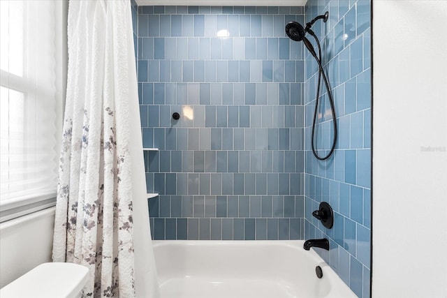 8848 Sunlit Cove Dr NE, Saint Petersburg, FL 33702 - full bathroom featuring shower / tub combo with curtain and toilet
