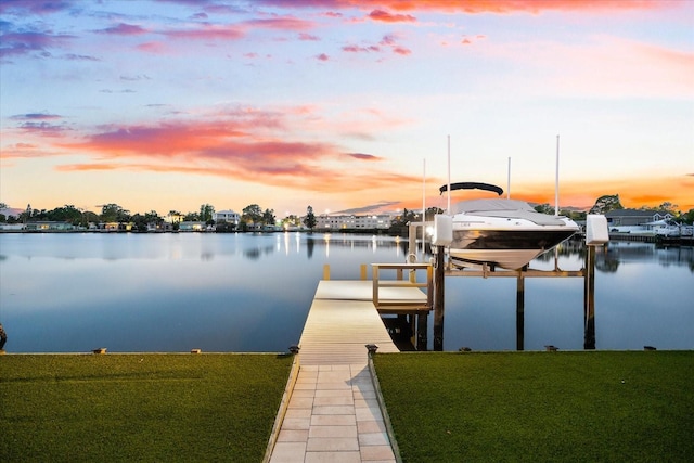 8848 Sunlit Cove Dr NE, Saint Petersburg, FL 33702 - dock featuring boat lift, a water view, and a yard