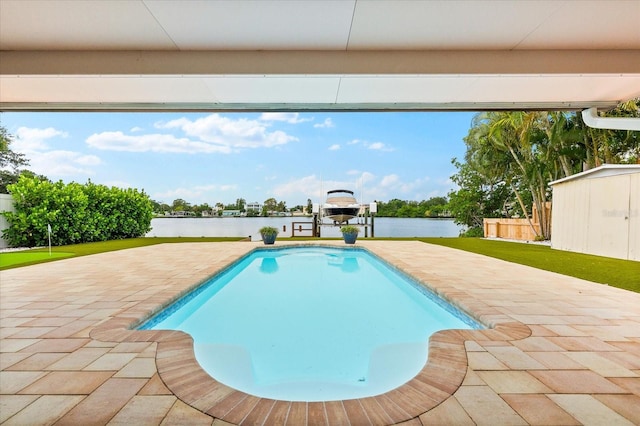 8848 Sunlit Cove Dr NE, Saint Petersburg, FL 33702 - swimming pool with a water view and a patio
