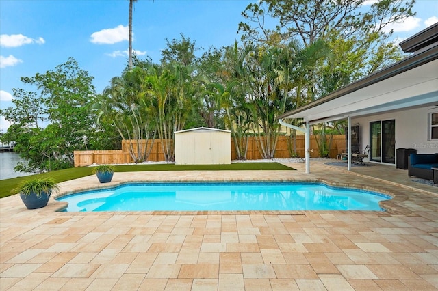 8848 Sunlit Cove Dr NE, Saint Petersburg, FL 33702 - view of pool featuring a patio and a fenced backyard