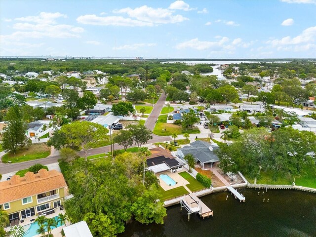 8848 Sunlit Cove Dr NE, Saint Petersburg, FL 33702 - aerial perspective of suburban area featuring a nearby body of water and a pool