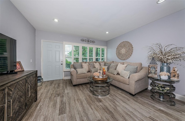5694 40th Ter N Unit 423, Kenneth City, FL 33709 - living area with wood finished floors, recessed lighting, and baseboards