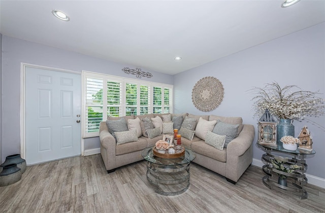 5694 40th Ter N Unit 423, Kenneth City, FL 33709 - living area with wood finished floors, baseboards, and recessed lighting
