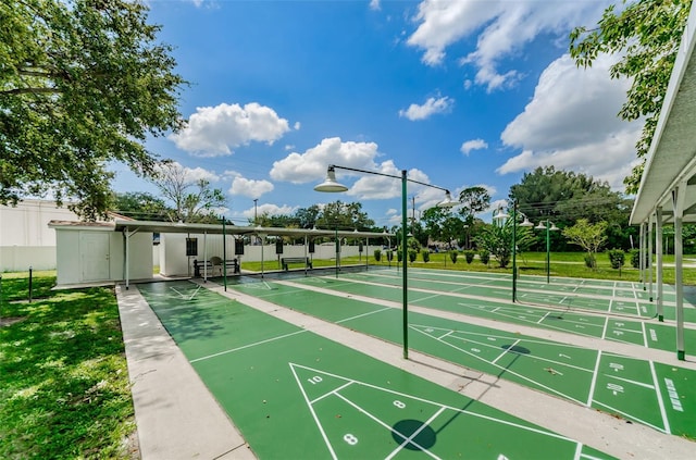 5694 40th Ter N Unit 423, Kenneth City, FL 33709 - view of property's community featuring shuffleboard and a yard