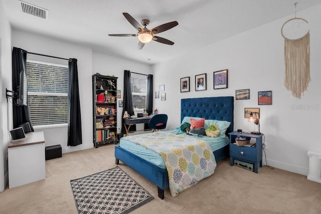 bedroom featuring carpet flooring, a ceiling fan, and baseboards