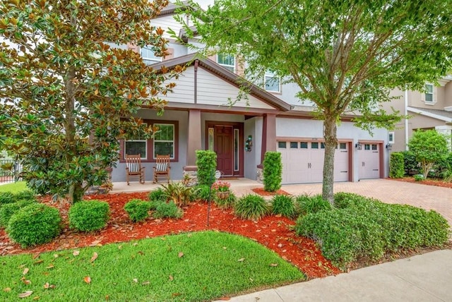 5724 Shell Ridge Dr, Lithia, FL 33547 - view of front of property with covered porch, driveway, and stucco siding