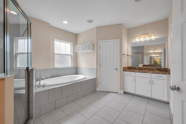 5724 Shell Ridge Dr, Lithia, FL 33547 - full bath with vanity, a garden tub, tile patterned flooring, and an enclosed shower