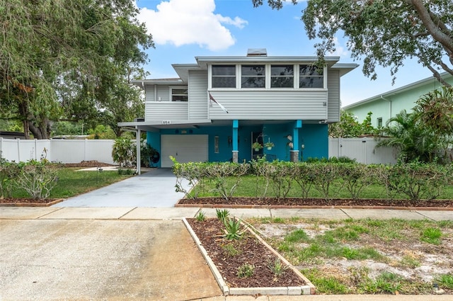 854 77th Ave N, Saint Petersburg, FL 33702 - view of front of house featuring driveway, a carport, and fence