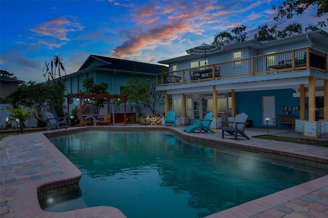 854 77th Ave N, Saint Petersburg, FL 33702 - rear view of property with a patio area, an outdoor pool, and a balcony