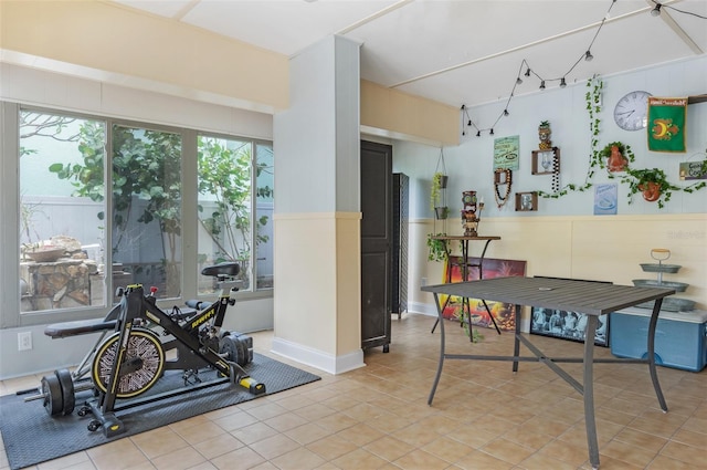 854 77th Ave N, Saint Petersburg, FL 33702 - dining room with wainscoting and light tile patterned floors