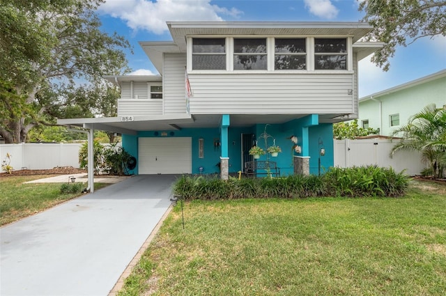 854 77th Ave N, Saint Petersburg, FL 33702 - view of front facade with an attached garage and concrete driveway