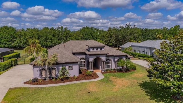5507 Keeler Oak St, Lithia, FL 33547 - view of front of property with driveway, a shingled roof, and stucco siding