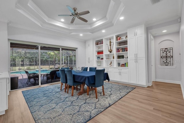 5507 Keeler Oak St, Lithia, FL 33547 - dining area featuring crown molding, a ceiling fan, a raised ceiling, light wood-type flooring, and recessed lighting