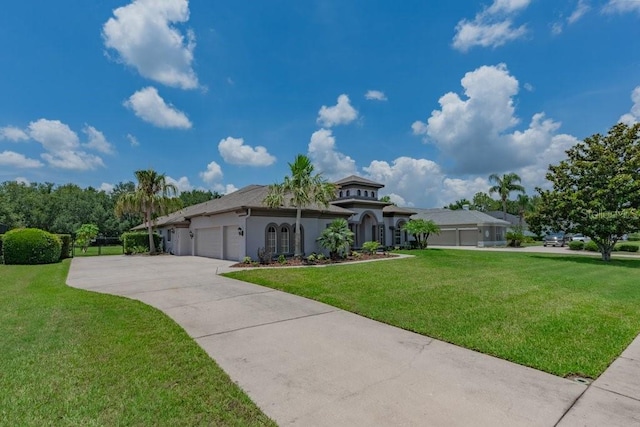 5507 Keeler Oak St, Lithia, FL 33547 - view of front of home with an attached garage, a front yard, stucco siding, and driveway
