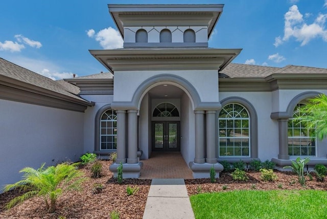 5507 Keeler Oak St, Lithia, FL 33547 - entrance to property with french doors, stucco siding, and roof with shingles