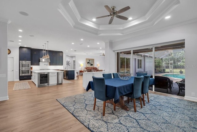 5507 Keeler Oak St, Lithia, FL 33547 - dining area with wine cooler, ceiling fan, ornamental molding, light wood finished floors, and recessed lighting