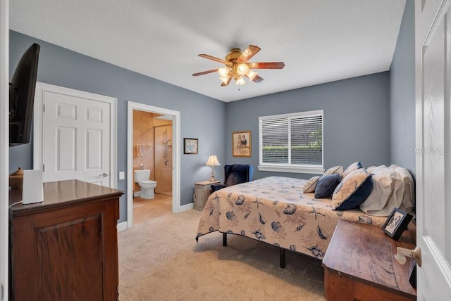 5507 Keeler Oak St, Lithia, FL 33547 - bedroom featuring light colored carpet, connected bathroom, and ceiling fan