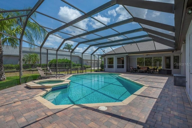 5507 Keeler Oak St, Lithia, FL 33547 - view of swimming pool with a patio area, a pool with connected hot tub, glass enclosure, and ceiling fan